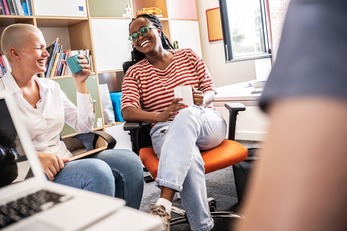 In a dynamic college office, a group of students brainstorming about education, culture, human rights, and race equality.