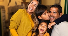 Happy Hispanic family having fun together