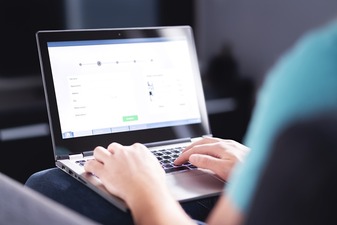  Filling electronic form on internet with laptop. 
