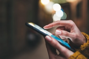 point finger on screen phone closeup, person texting text message