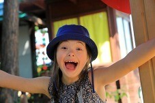 Young girl with hat at camp 