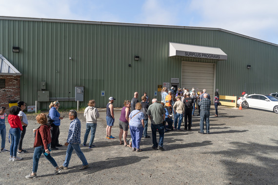 People lined up outside during the Grand Re-Opening event at the Surplus Retail Store. 