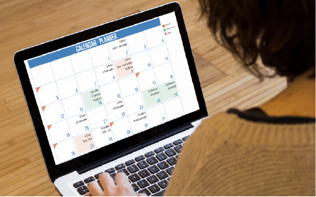 Person viewing a calendar on their computer