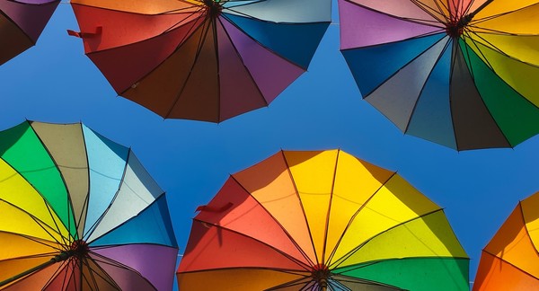 Several multi-colored umbrellas.