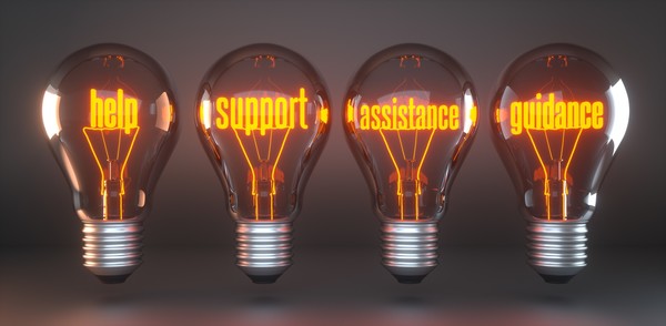 Light bulbs that say help, support, assistance, guidance.