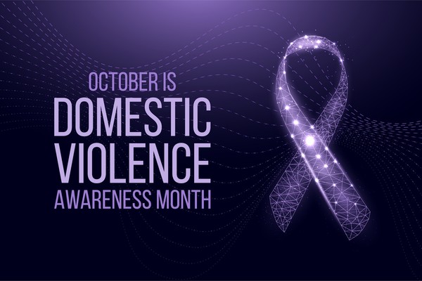 October is domestic violence awareness month. Purple awareness ribbon.