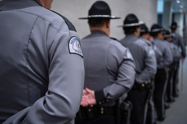 State Patrol troopers in uniform during a 2023 swearing-in of Commercial Vehicle Enforcement Officers. Photo courtesy Washington State Patrol.