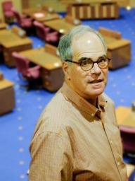 A picture of Steve Jones standing inside a legislative chamber.