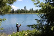 Youth fishing lake during WDFW youth fishing event