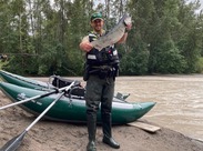 Officer Murray on a river patrol checking salmon anglers.