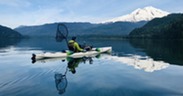Kayak angler fishing for sockeye on Baker Lake with Mt. Baker in background