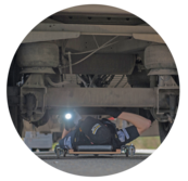 Image of Washington State Patrol Officer inspecting truck