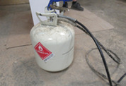 Paint sprayer tank and nozzle