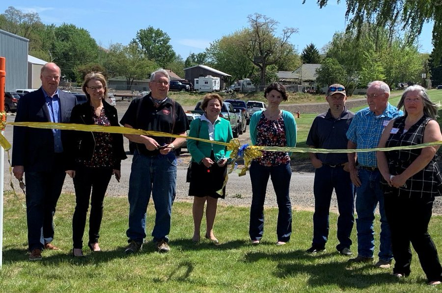 Photo of outdoor ribbon cutting at Public Works project in Pomeroy