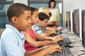 Diverse group of kids at computers
