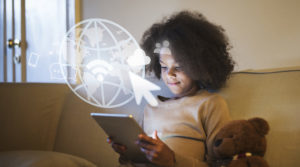 Image of little girl working on a computer