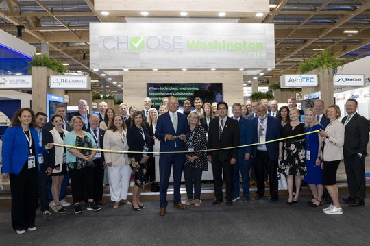 Group photo of ribbon cutting at Paris Air Show 2023