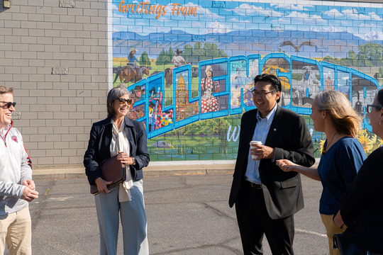 Director Fong meets with leaders to see murals.