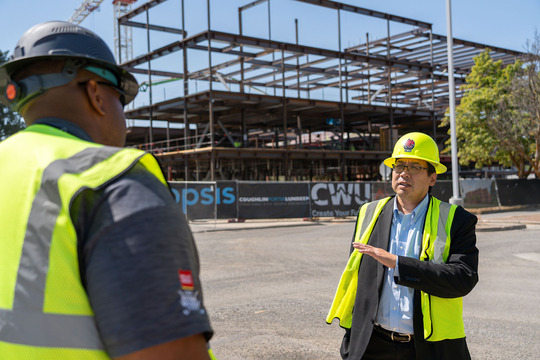 Commerce Director Mike Fong visits the Central Washington University campus geothermal project.