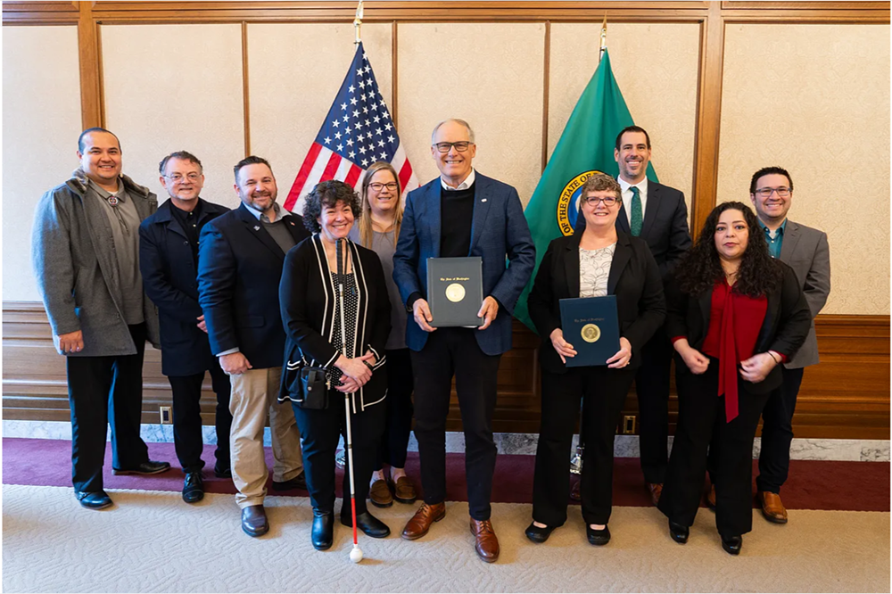 Washington Gov. Jay Inslee with members of the WA DDC. 