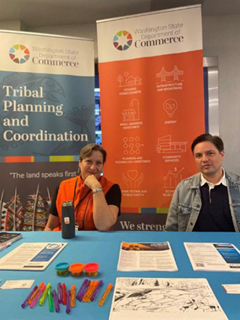 Two people attending the ATNI event sit at a table.