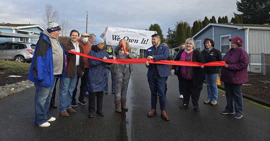 Residents cut the ribbon at Ohana Estates.