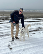 Man on beach with a dog
