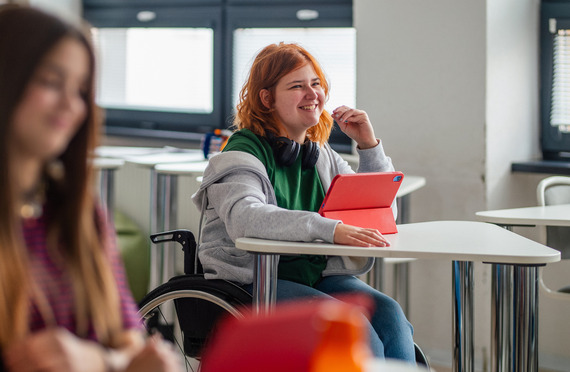 Inclusive classroom scene with student using wheelchair