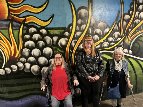 Council members (Left to right) stand in front of Port Angeles mural