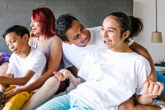 Family gathered together smiling