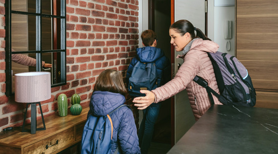 Family with backpacks leaving home during an emergency