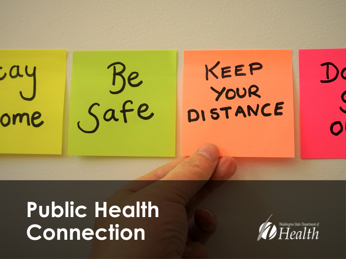 Sticky notes on the wall reading "Stay Home," "Be Safe," "Keep Your Distance," and "Don't go out!"