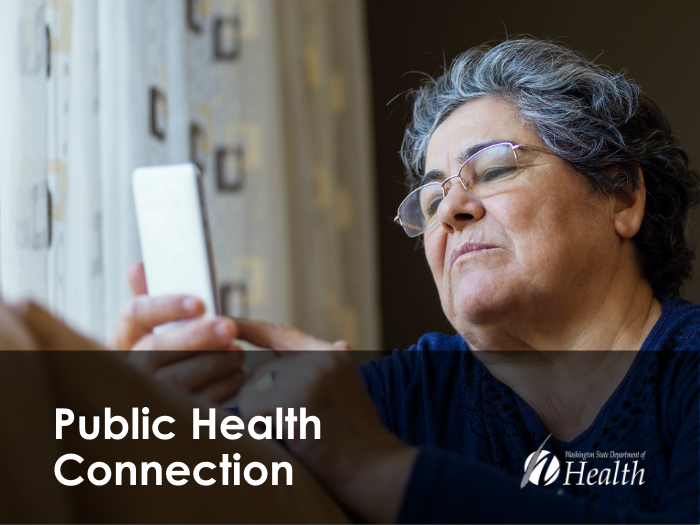 woman looking at smart phone