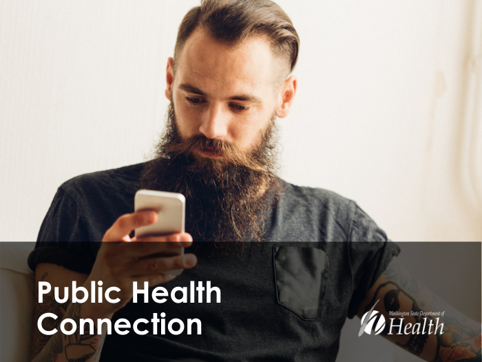 man looking at phone