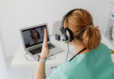 Healthcare provider talking to patient on laptop