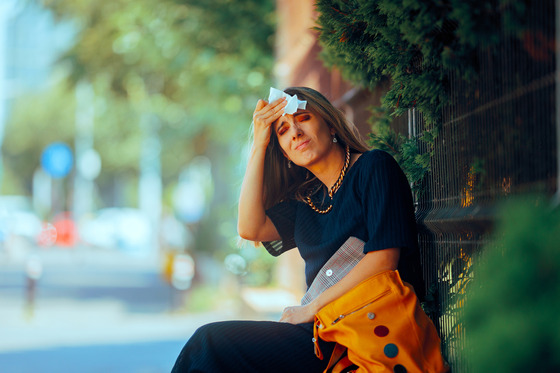 Woman Suffering During Hot Summer Resting Outdoors