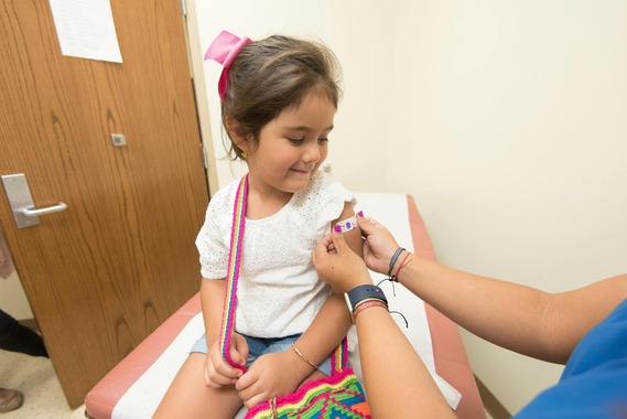 Little girl getting vaccinated.