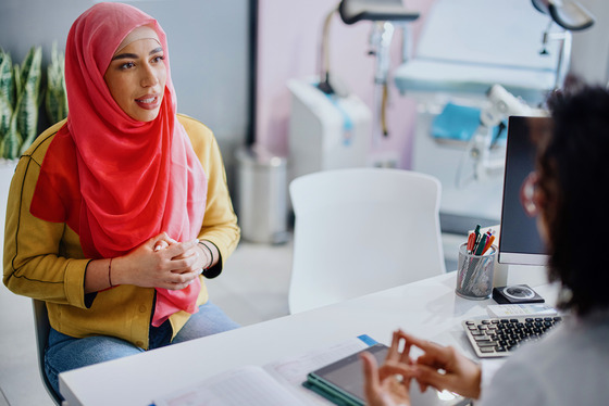 Patient and doctor talking in office