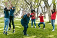 Happy group of people playing lawn games