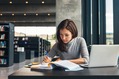 Woman studying in library