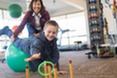 Boy on balance ball doing occupational therapy