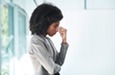 Stressed woman pinching nose