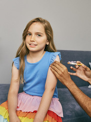 Young girl getting back to school vaccines at the doctor's office. 