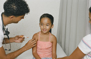 young girl getting a vaccine at the doctor's office. 