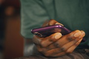 Image of a person holding a cell phone