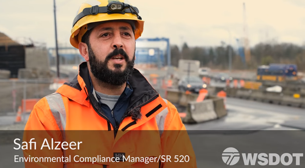 Image of man in construction vest and hard hat.
