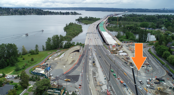 Photo of construction work zone leading to eastbound SR 520. A large orange arrow points to the temporary on-ramp.