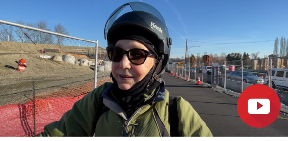 Photo shows video still of a bicyclist on the SR 520 trail 