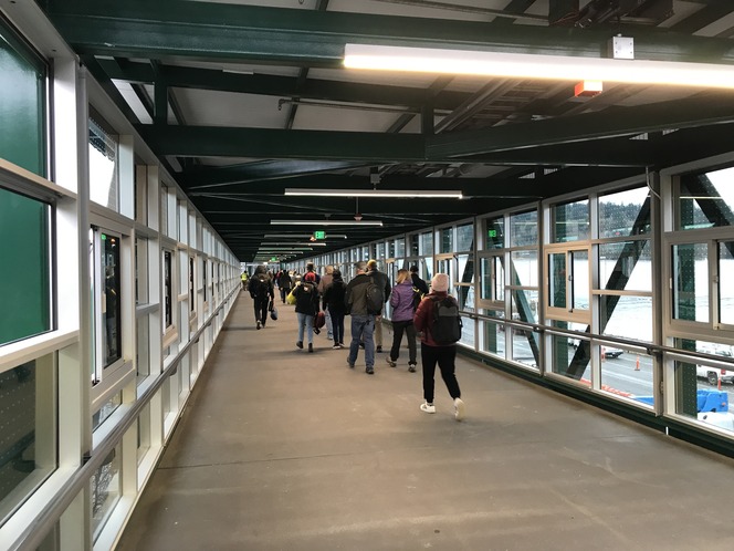 Opening day of the new passenger walkway at Bainbridge Island shows passengers using the new structure.