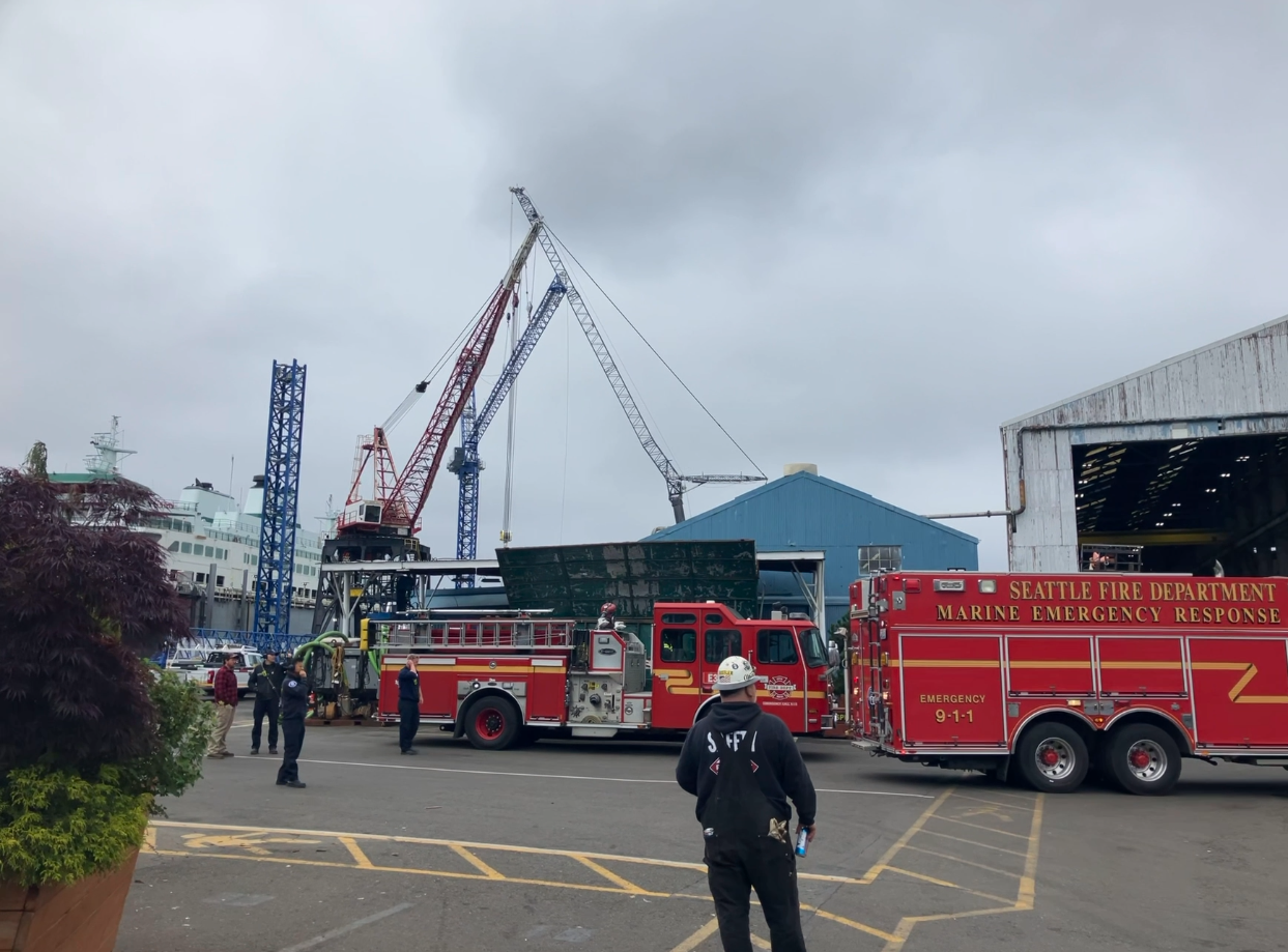 Seattle Fire department staff gather around Wenatchee for a fire drill on board